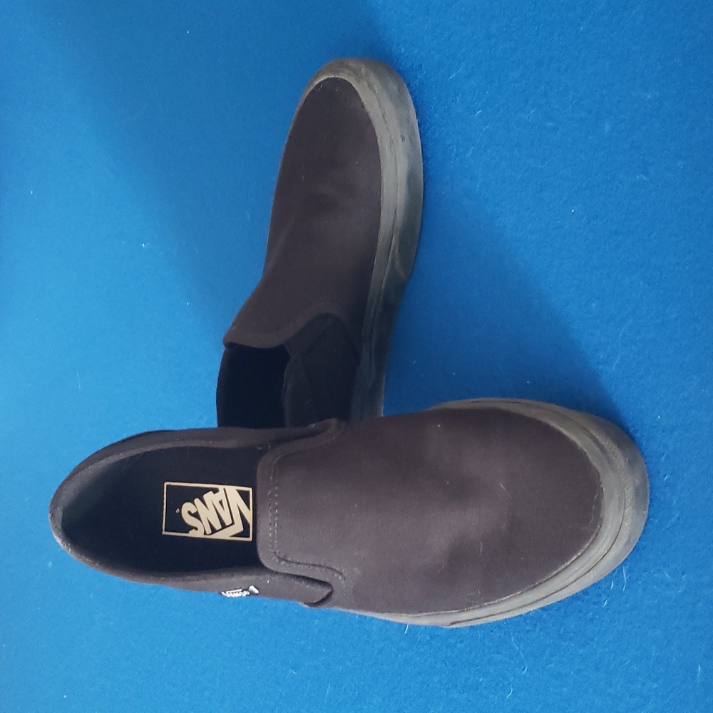 Vans black canvas slip-ons